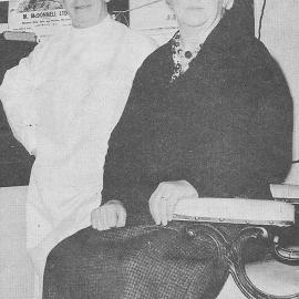 Mr and Mrs Eddie Flood in their Tainui Street hairdressing  shop.1965.