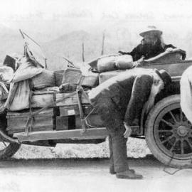  Newmans service car travelling through the Buller Gorge with 7 passengers - held up with puncture trouble.