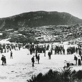 Denniston miners and their families on a Sunday on the Snow covered Recreation Ground at Denniston .