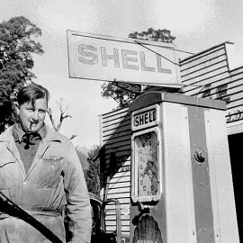 Doug Kerr serving petrol at Fox Glacier Garage. 