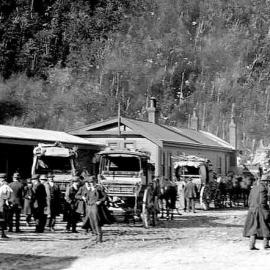 Scene at Arthurs Pass,showing area around railway station with crowds and horse-drawn carriages.