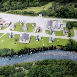 Gunns Camp in the Hollyford before and after the slip.