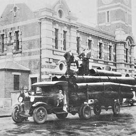 John Rubbos on truck by the Greymouth P.O.with a load of  pipes for Snowy River Mine..