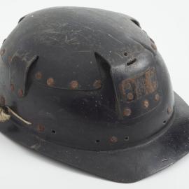 This helmet was worn by miner Donald Ross (1923-2015) in the Strongman Mine in the 1950s.