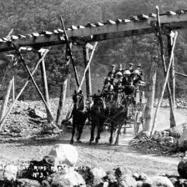 Coach at Bealey Flat - going under rail bridge.1913.