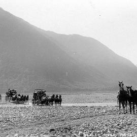 Coaches lined up to cross the Bealey River