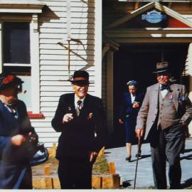 Charlie Crook in dark suit and hat I assume Anzac Day by the medals.