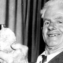 Charlie Jacobsen holding his Geiger counter and highest clicking uranium sample