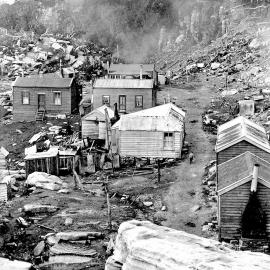 The Camp , Denniston in the 1920s -  One lone child on the road and not a garden in sight.