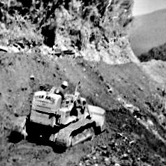 Gordon Barnes on his bulldozer - after leaving Lake Moeraki just past Boulder Creek.ca.1960`s