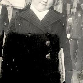 My Mum (aged 8) at Greymouth waiting for the railcar to go to Christchurch.