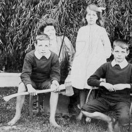 Clarice Parkinson,of Parkinson`s Chemist, with children Arnold and Vera and cousin, Greymouth ca 1910.