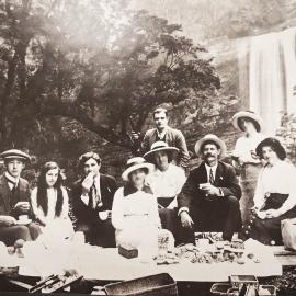 Family and friends picnic by the Mangatini Falls up the Ngakawau River.