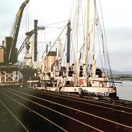 The  m.v. Konui of the Union Steam Ship Company loads coal at Westport. 1958.