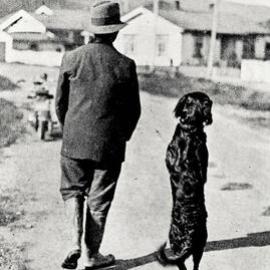 T. Richardson of Greymouth and his dog Bob, well known for its ability to walk on his hind legs for miles.1934.
