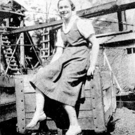 Kathleen Walker nee Evans sitting on a coal bin - Burkes Creek Mine.Reefton.