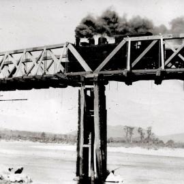 Rewanui bound train in the late 1960's on the old rail bridge reaching the north bank of the Grey River