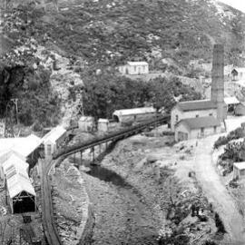 Burnett Stream with river and curved railway bridge,Denniston.