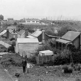 Side Road and Waiuta School with Joseph Divis in foreground.ca. 1920-1933.