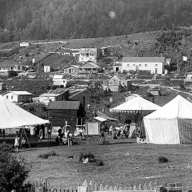 Fair on the recreation ground in Waiuta with Top Road in the background.ca 1920-1933.