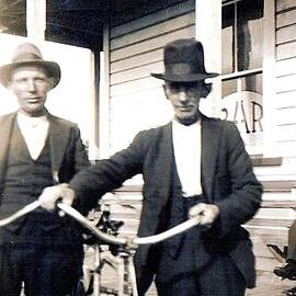Frank Sullivan holding bike out side Te Kinga hotel.1940`s
