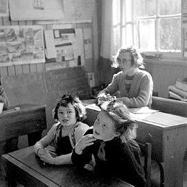 Children from Weheka School sitting at desks. Aug 1953.