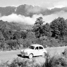 Morris Minor car parked on a gravel road, Buller Gorge .Aug 1960.