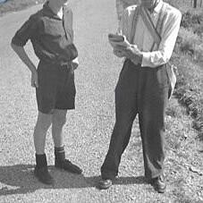 Terry O'Leary getting autograph from A H Reed at Paroa. ca.1960.