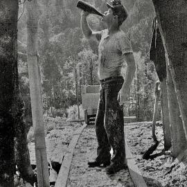 Miner drinking from bottle