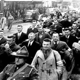 Men marching to Greymouth railway station going to war. 1940