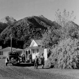 People outside the equipment room at the hostel, Fox Glacier.Jul 1953.