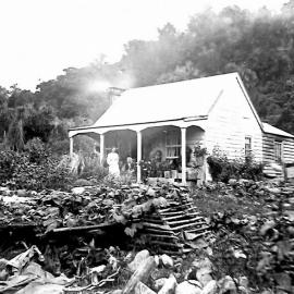 Mrs Graham's cottage, Franz Josef -  Mrs Graham and Annie Gunn on verandah.