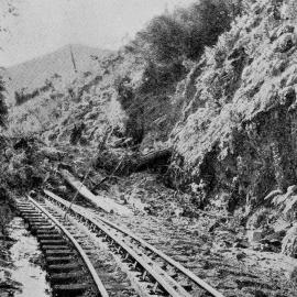 Debris blocking the railway line between Dunollie and Rewanui after a winter rainstorm.1938.