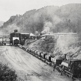 A  view of the state mines at Dunollie - showing a coal train leaving the bins.1910.