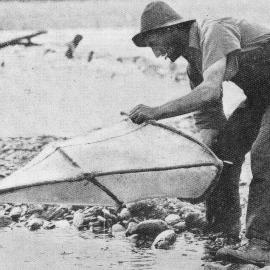 A Whitebaiter operating at the Mahitahi River, near Bruce Bay.