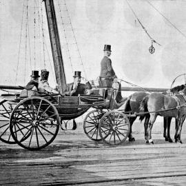 R. J. Seddon, Mrs Seddon, and J. G. Ward arrive at the wharf in a horse and carriage to farewell the troops to South Africa.1900