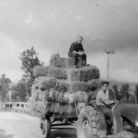 Bob McMillan and Colin McMillan driving at tractor on Oneone Road, Hari Hari
