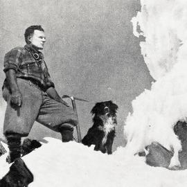 Alpine guide, Frank Alack, with his dog,crossing  the Southern Alps from Westland to the Hermitage, Mount Cook.1932.