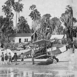 Westland Air Service plane lands on the beach at Bruce Bay when making their regular calls.1937.
