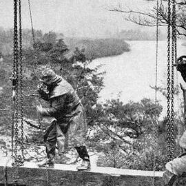 Working on an overhead cable transporting material across the Buller Gorge.1939.