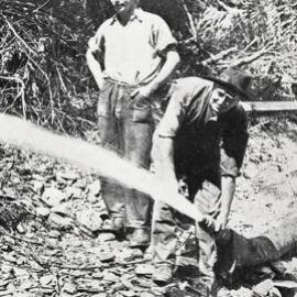 Solving their own problems of unemployment  - two men at work on a sluicing claim, West Coast.1932.