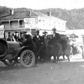 Touring cars stop outside the Hampden Hotel, Murchison.