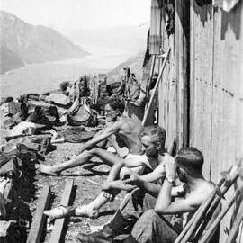 Frank Gillett, Tom Newth at Haast Hut, December 1939.