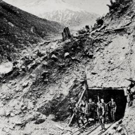 The Bealey end of the Otira Tunnel showing Engineers and Workmen at the entrance.