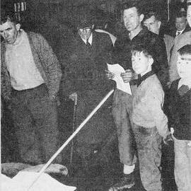 Auctioneer Bernie Connors of Greymouth disposing of the contents of the Cobden Engineering Co.1964.
