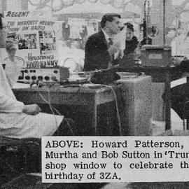 Howard Patterson, Reon Murtha and Bob Sutton in Trumans shop window to celebrate the 1st birthday of 3ZA .