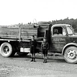 Ray Jollie and Barry Surton, from Kotuku , outside Molloy's Garage and the Molloy Home. ca.1948.