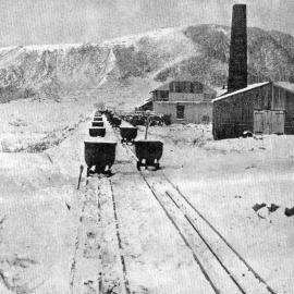 Snow stops work at Denniston - Idle railway trucks from the mine.1939.