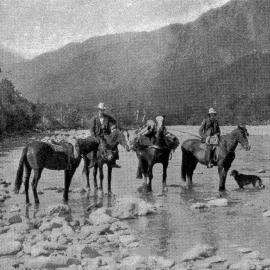 A survey party carrying mail and supplies crossing the Kokatahi River.1939.