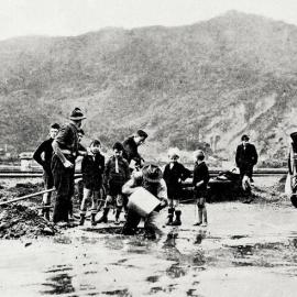 Workmen repairing a broken water main on Mawhera Quay, Greymouth.1929.